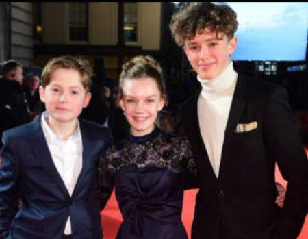 Kit Conor with his co-stars attending the movie's premiere.